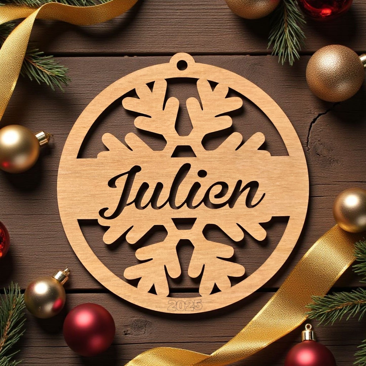 Wooden snowflake ornament with 'Julien' name, surrounded by Christmas decorations snowflake.